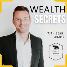 Portrait of a smiling man in a black blazer and white shirt with text 'Wealth Secrets with Sean Adams' and a Leverage Life logo.