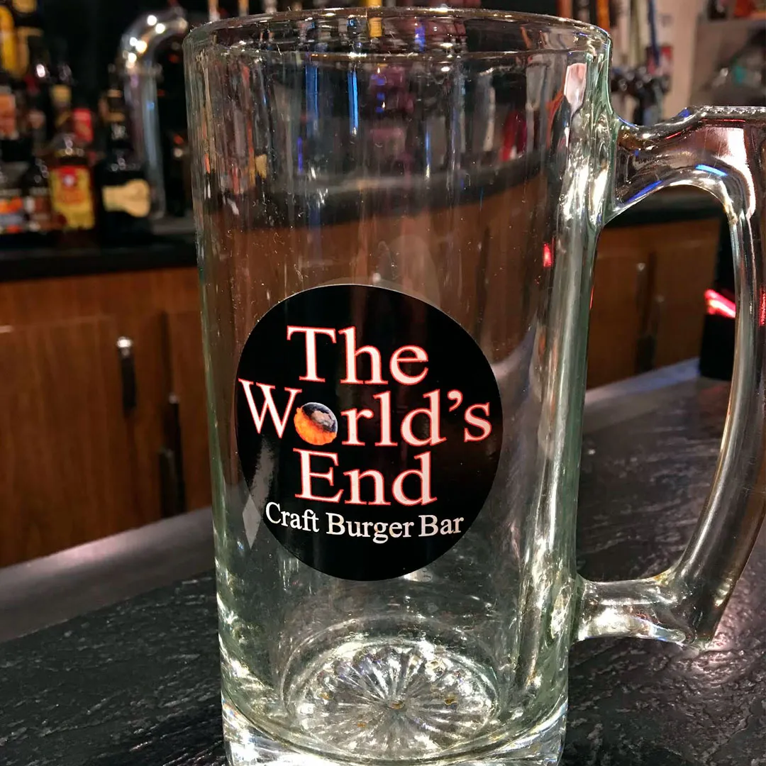 A glass with The World's End Logo