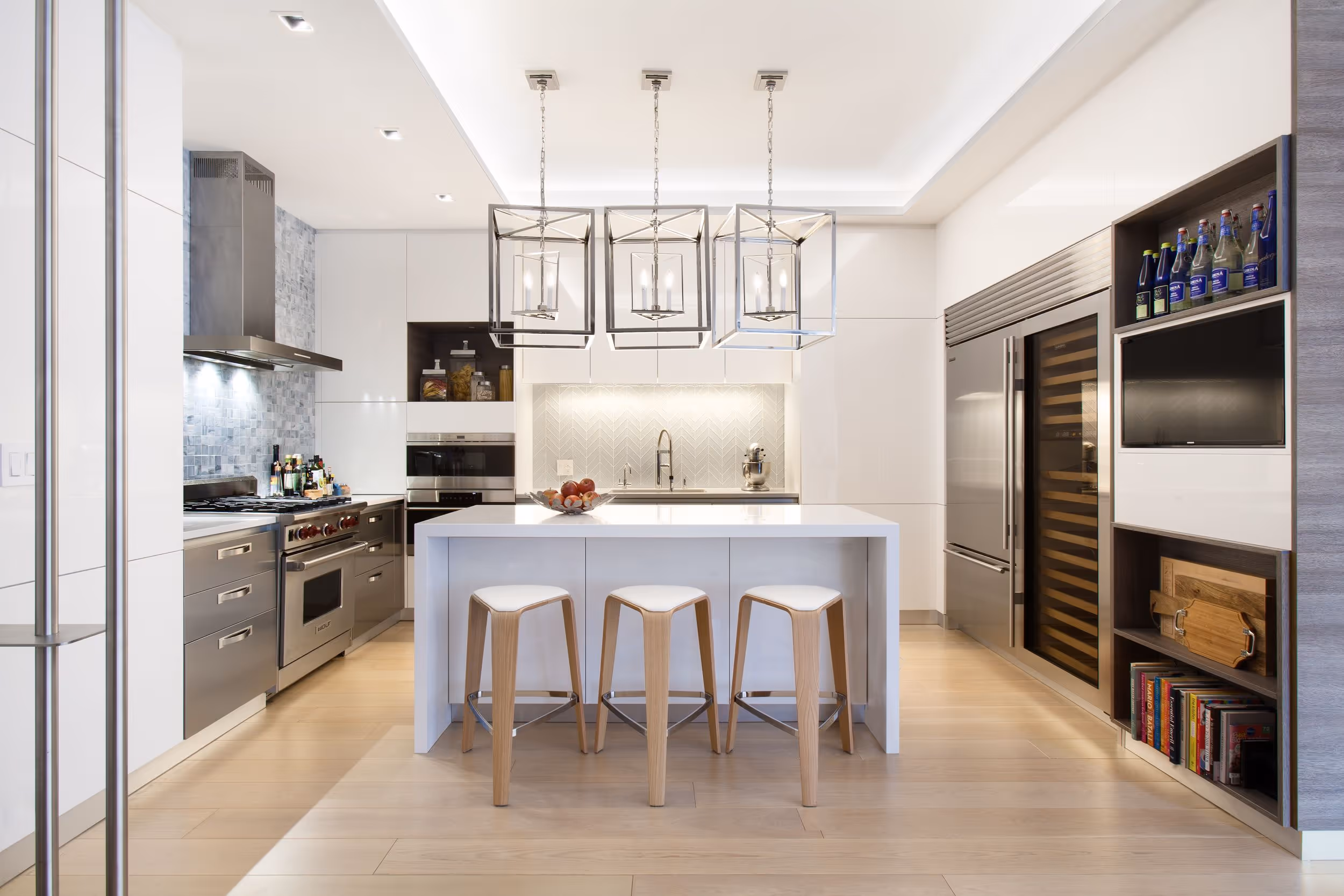 Modern NYC kitchen renovation with custom cabinetry and waterfall island.