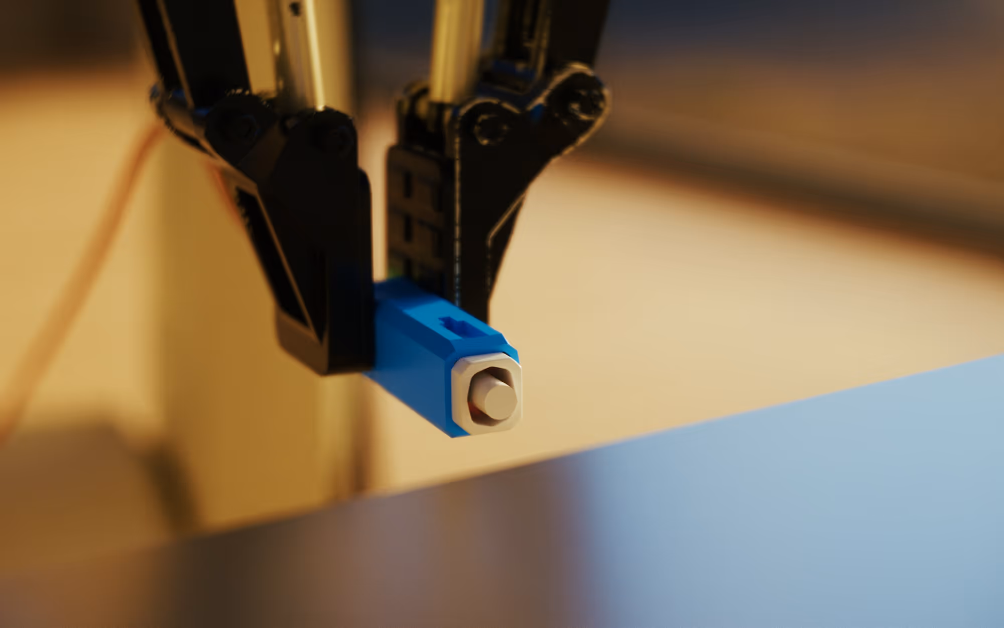 Close-up of a 3D printer nozzle extruding material onto the print bed.