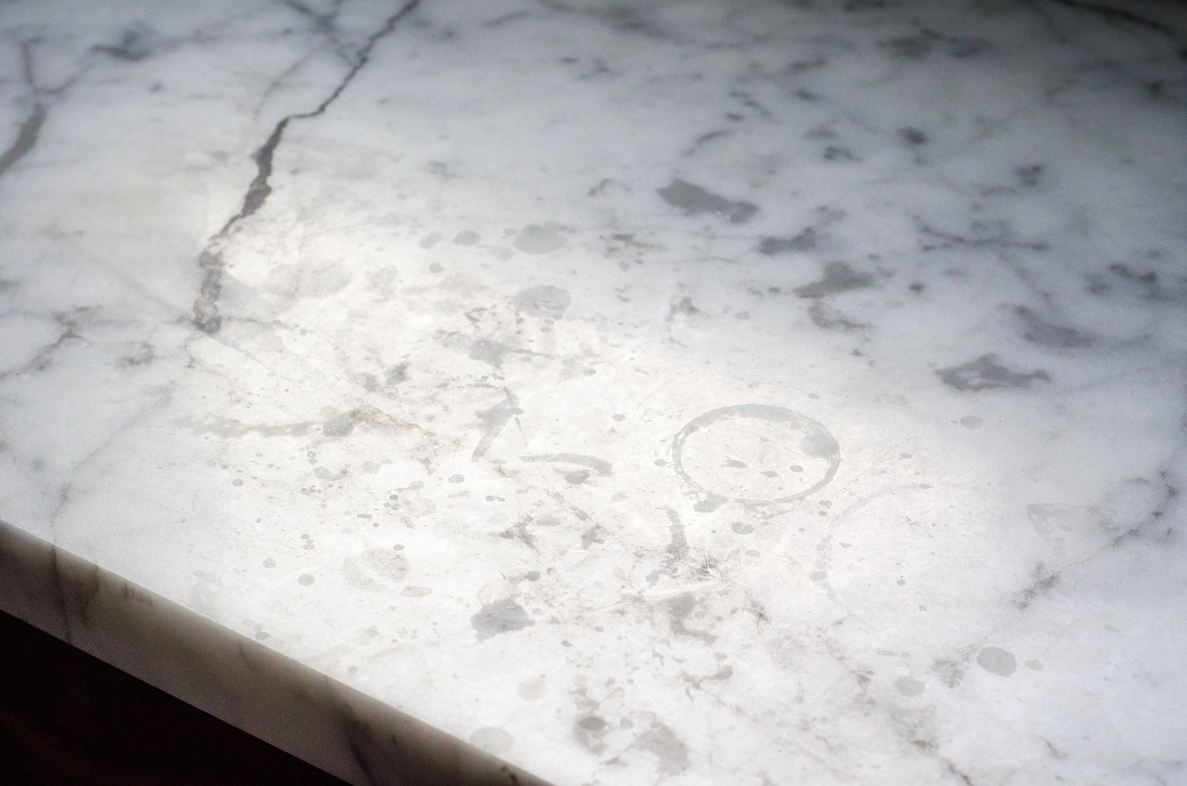Etching and water ring marks on marble counter