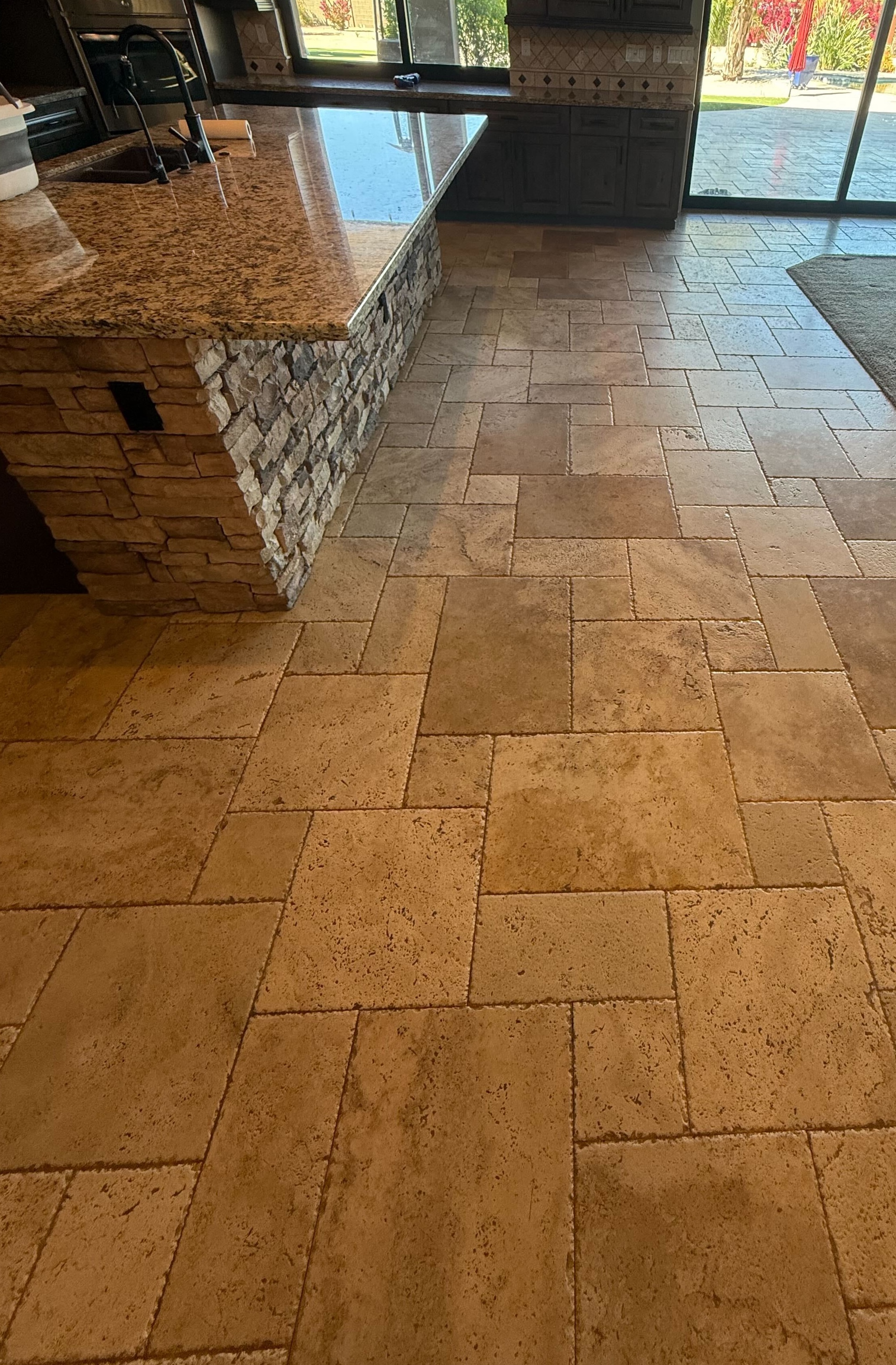 Pitted travertine tile floor fill