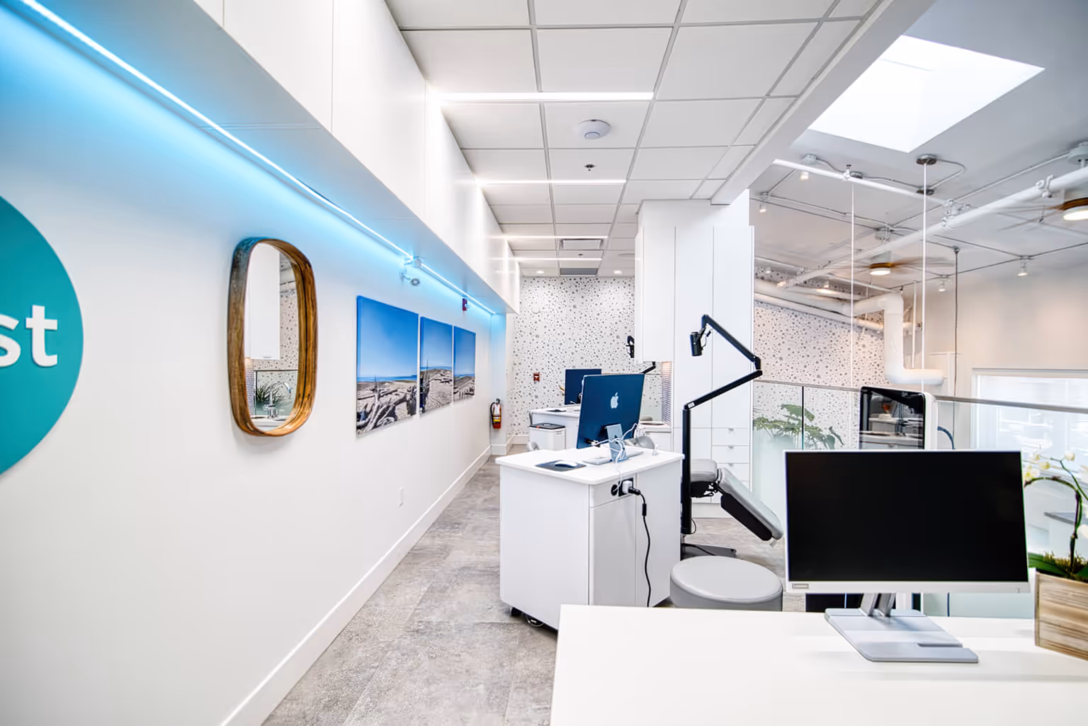 Modern clinical workspace at Coast Dental Specialists with dental equipment and desks
