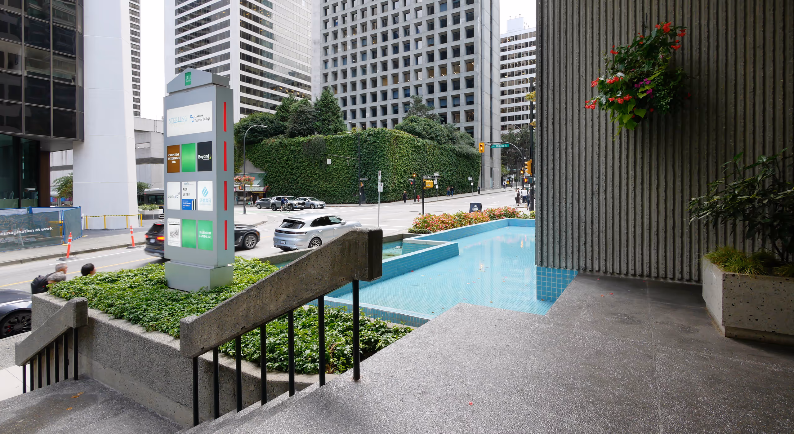 Exterior signage and courtyard at 1111 Melville multi-tenant office building.