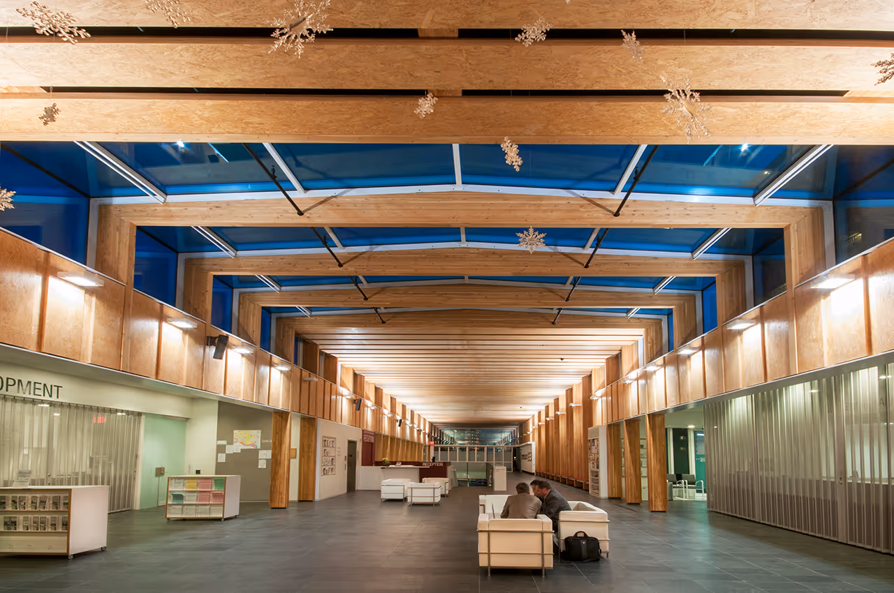 Reception area at North Vancouver City Hall Redevelopment with seating, lighting, and information displays.