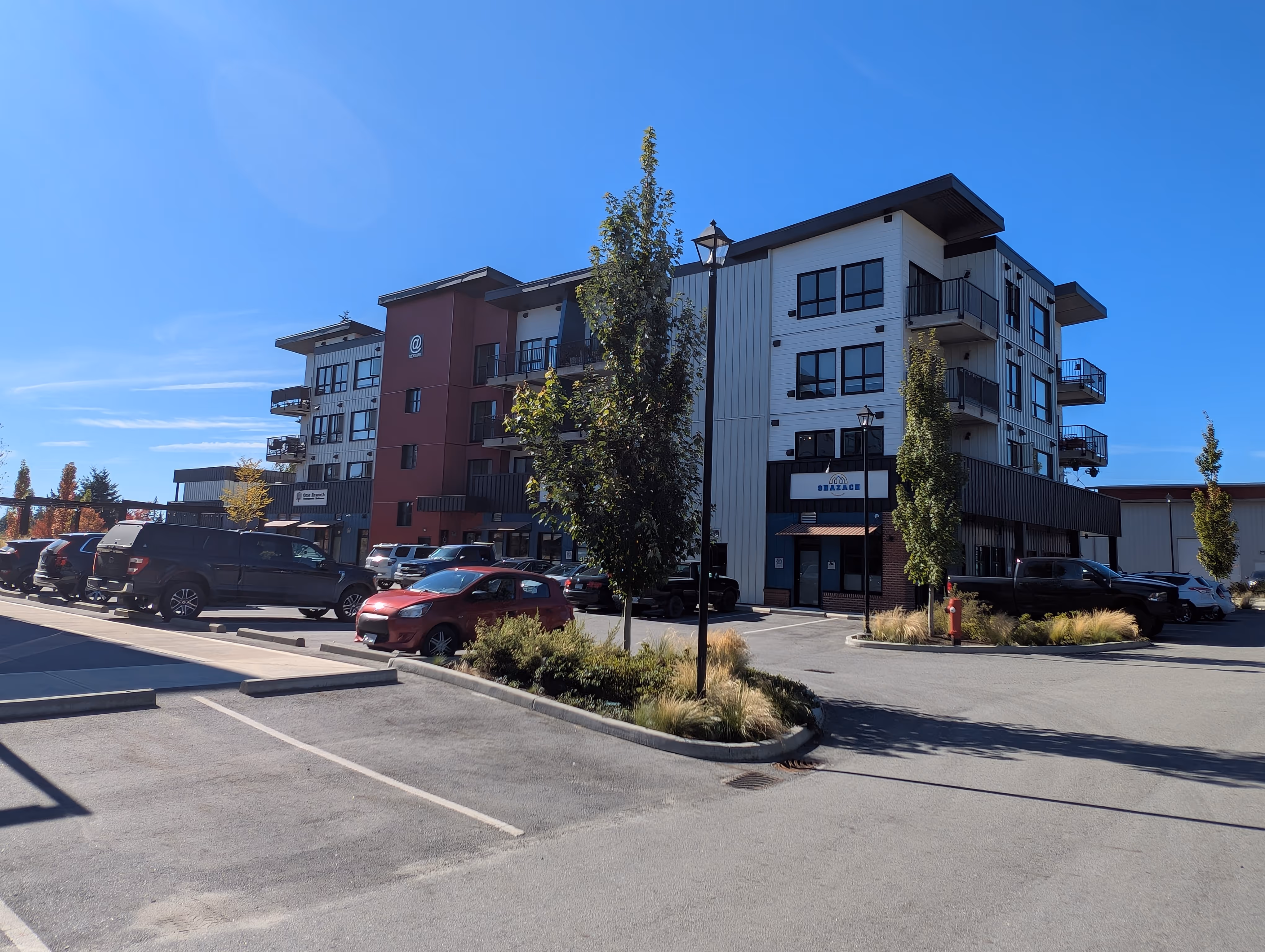 Row of commercial units at Venture Industrial Village showing finished building façades with integrated electrical and lighting systems.