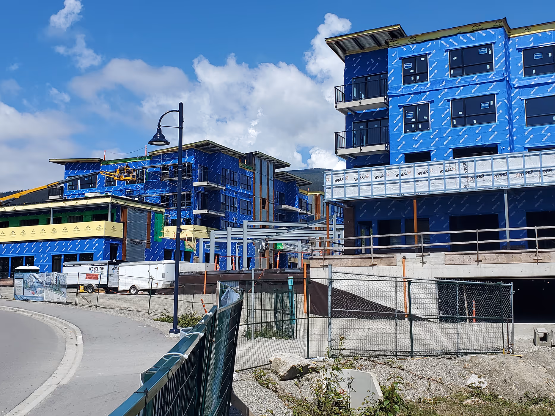 Exterior of Venture Industrial Village during construction with integrated electrical systems across residential, commercial, and industrial spaces.