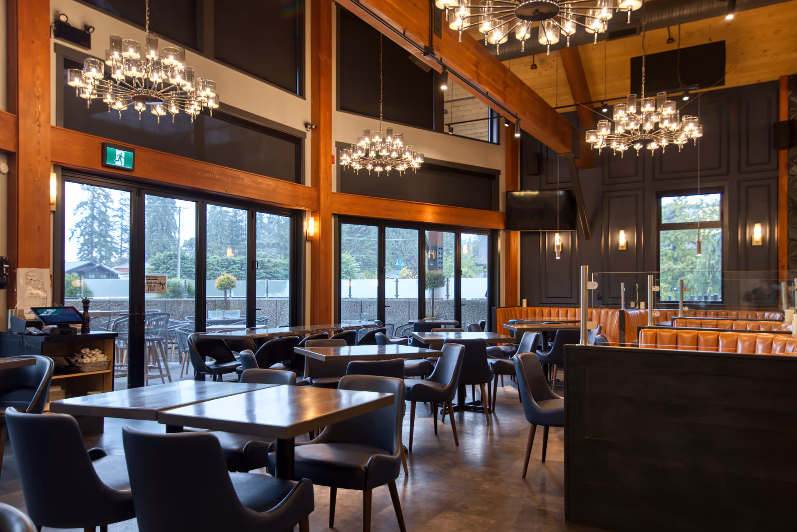Restaurant dining hall with chandeliers and integrated lighting systems at Twenty Two Taphouse