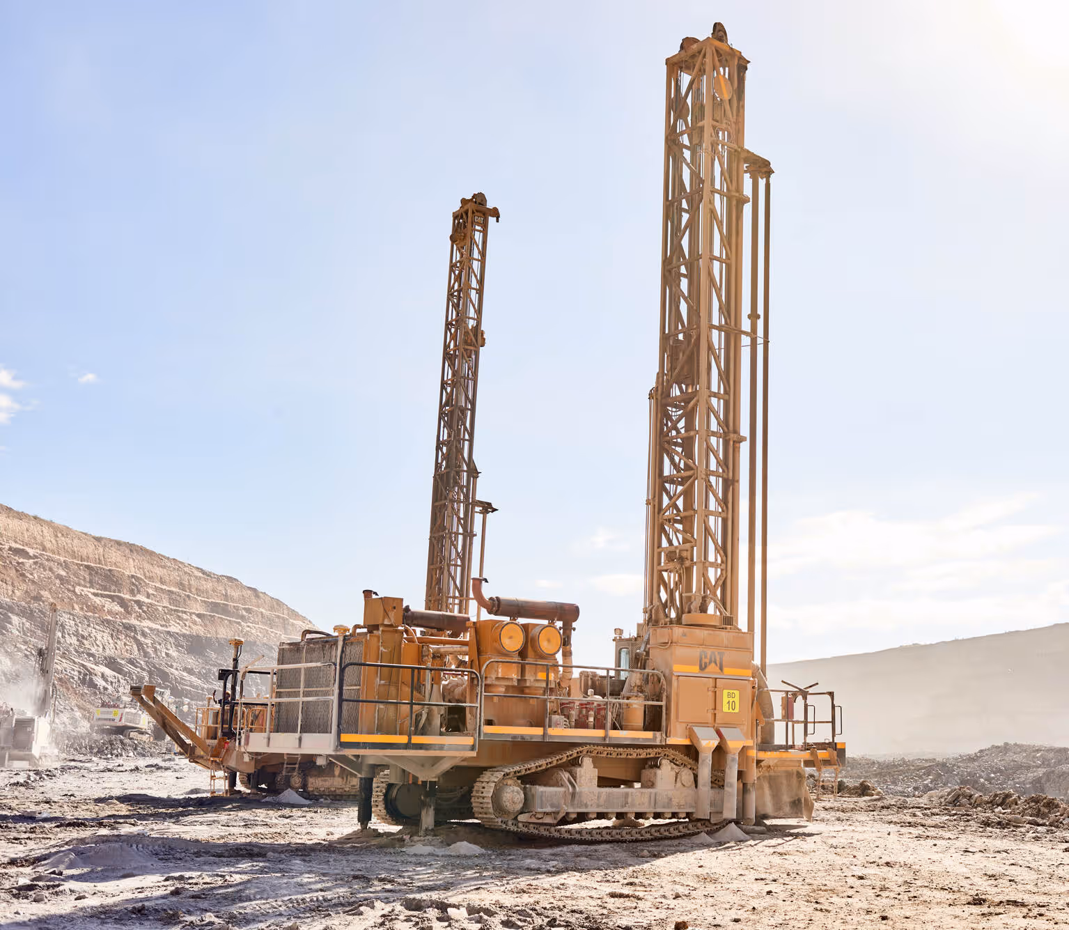 Blast drill rigs operating inside the open-pit mine at Otjikoto, Namibia