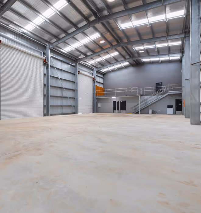 Structural steel warehouse and office facility under construction in Karratha.