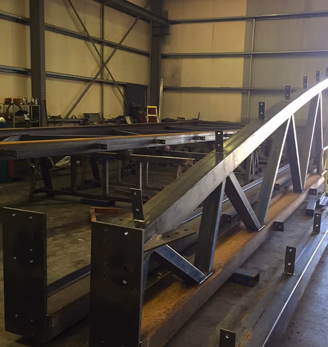 Modular truss sections during fabrication for the Broome netball court cover.
