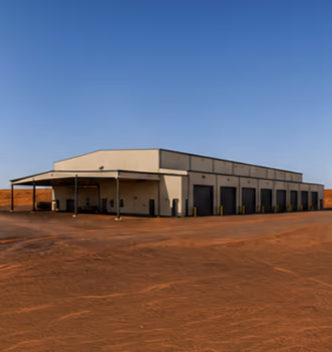 Rangecon Kalgoorlie workshop showing 15 roller door access points and full-length cantilever canopies.