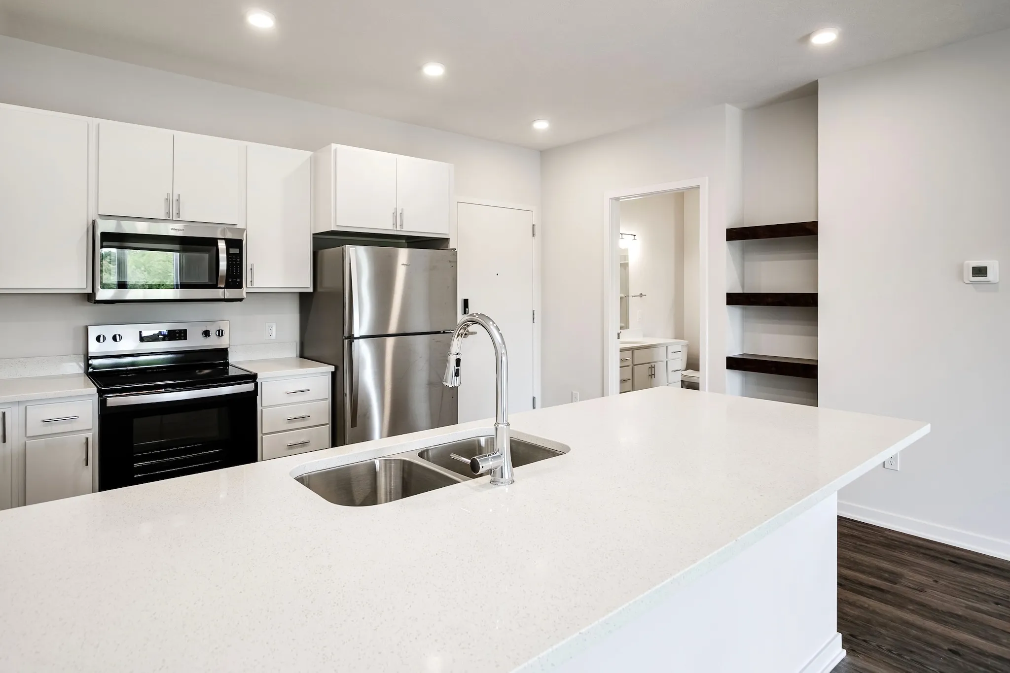 Kitchen with white countertops and stainless steel appliances 