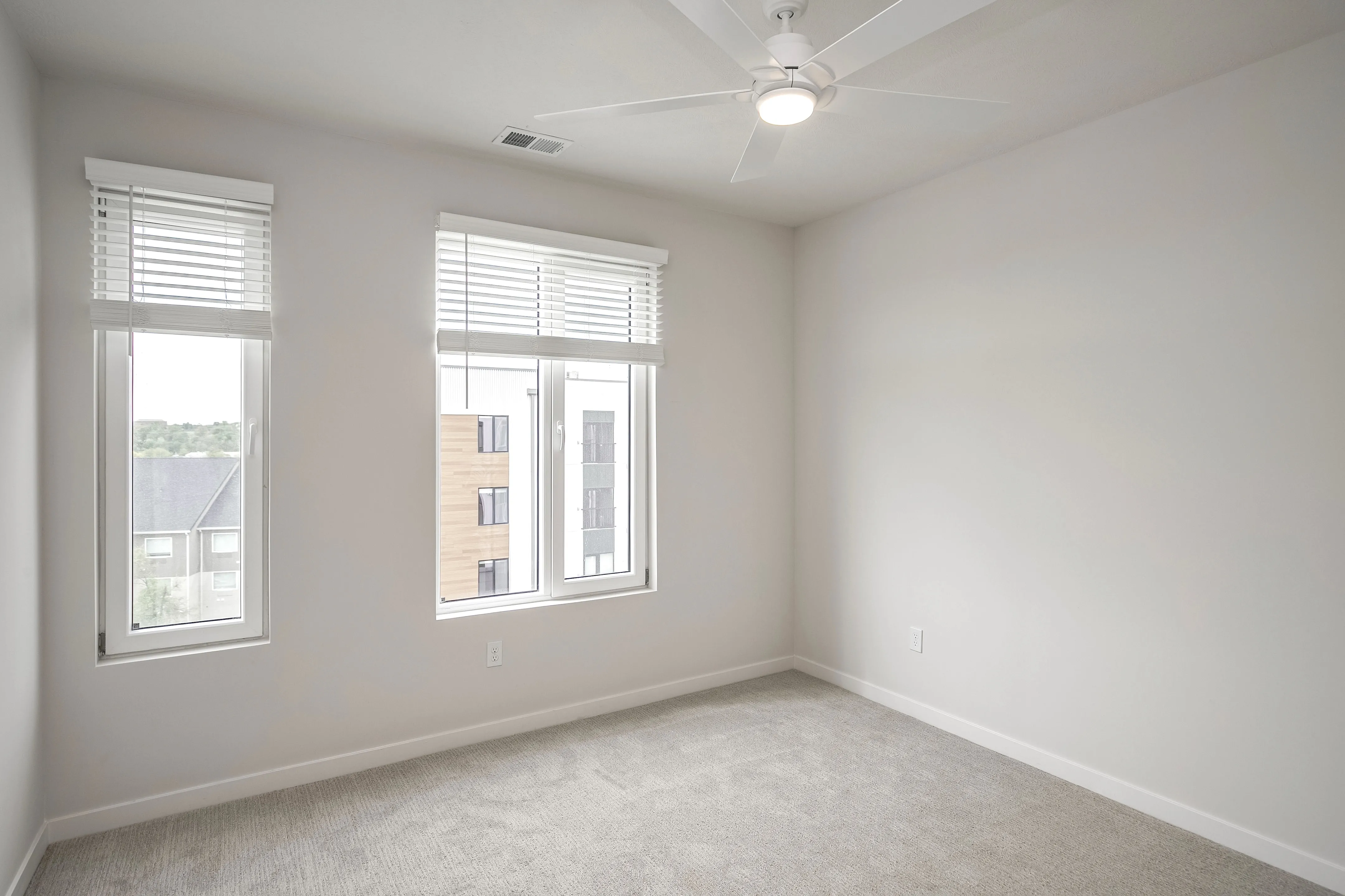 Empty bedroom with windows