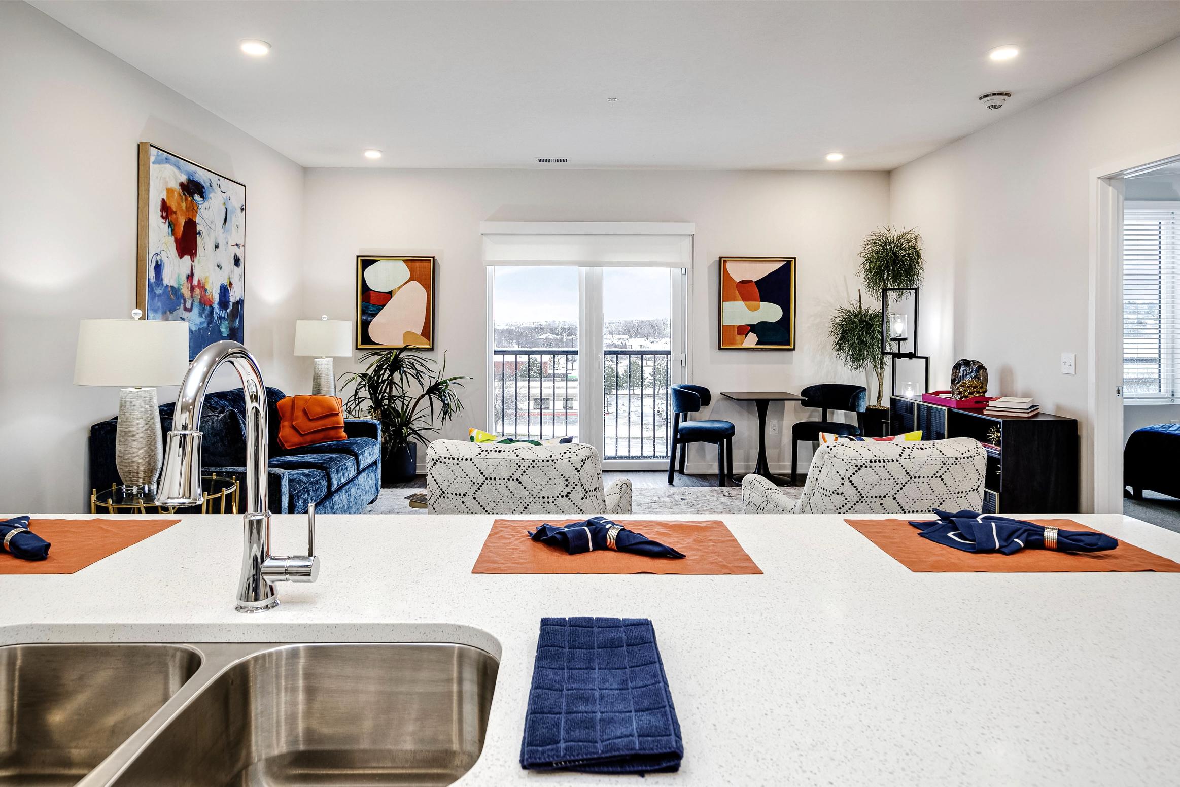 Kitchen with white countertops and stainless steel appliances 