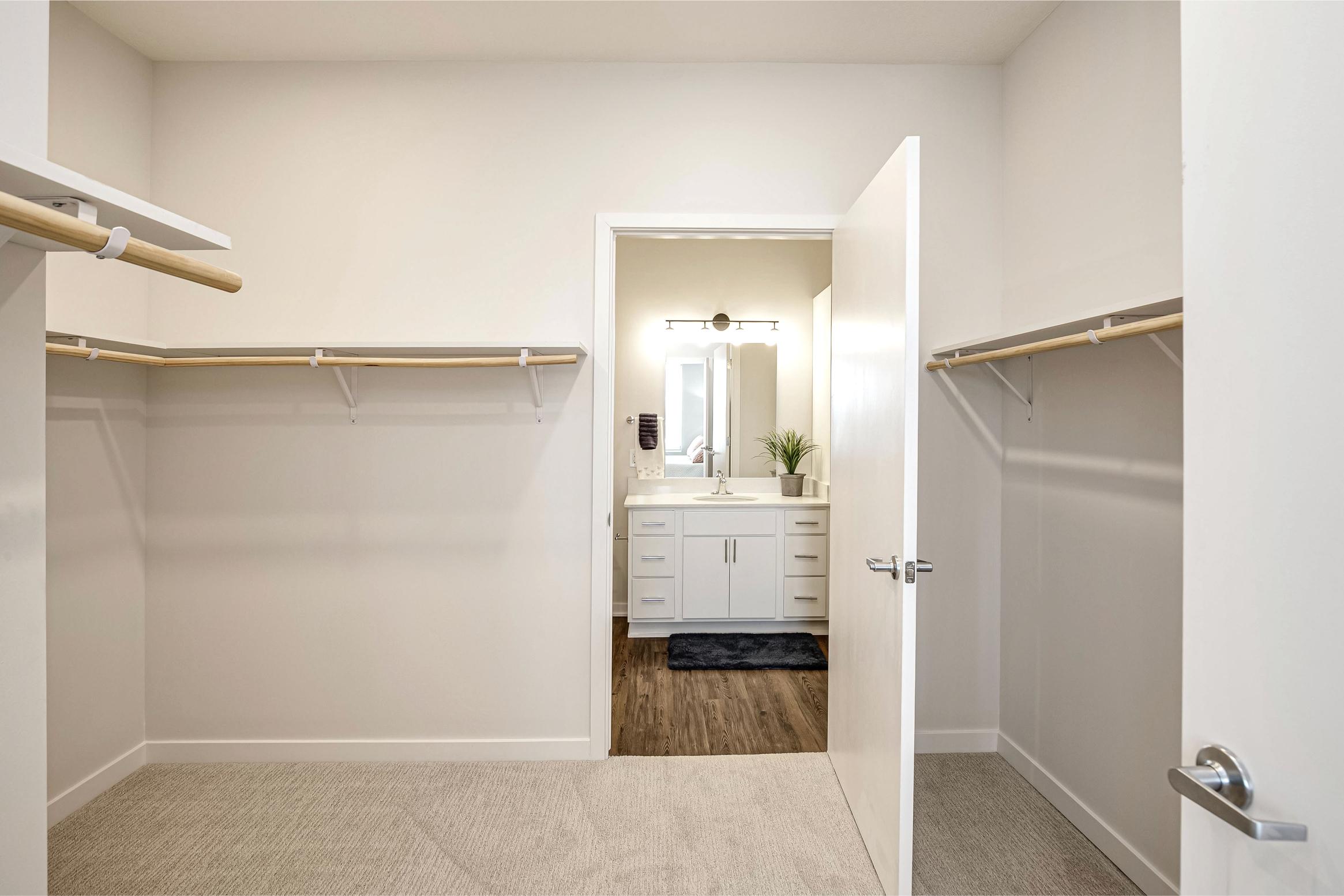 large closet with view into bedroom