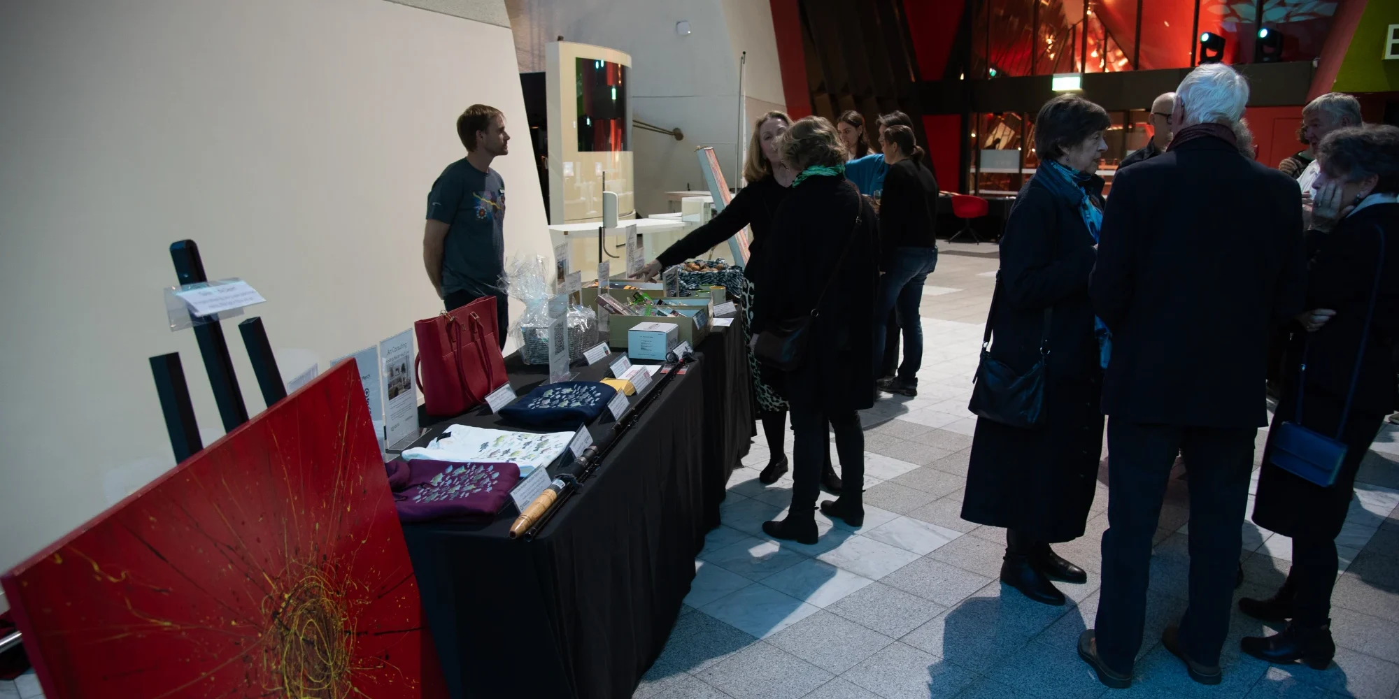 Attendees bidding on the silent auction prizes during interval. Photo credit: Ben Curry