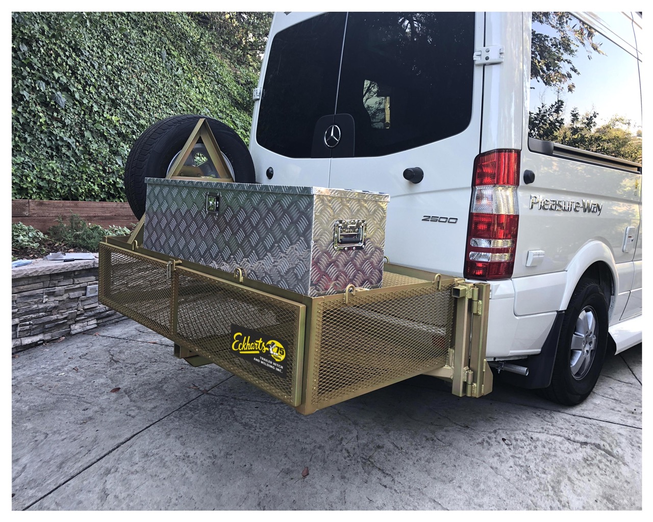 Custom swing-away double-decker cargo and bike rack built by Eckharts.