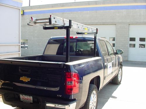 Custom removable one-sided utility rack fabricated for a pickup truck.