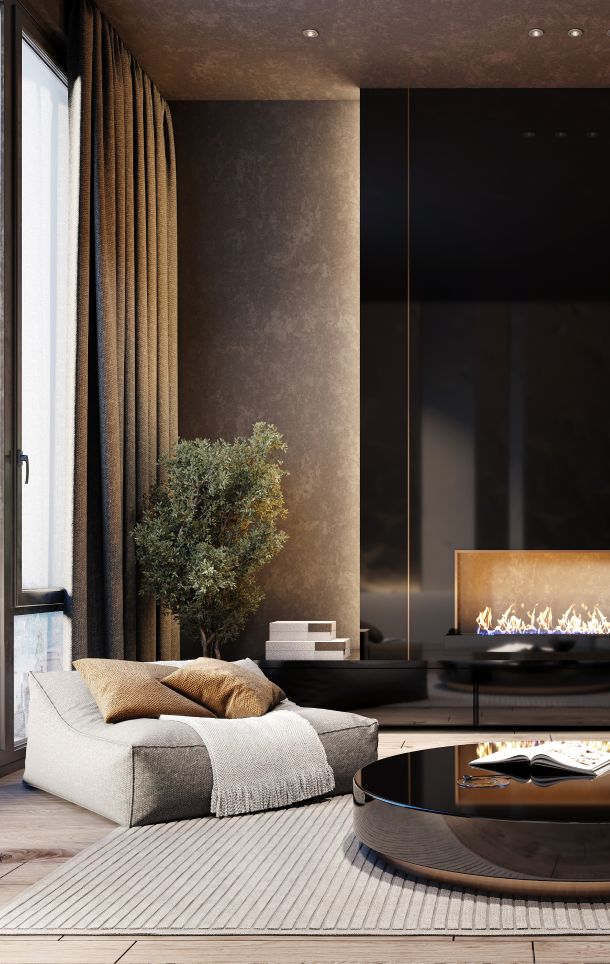 Cozy modern living room corner with a beige lounge chair, soft pillows, a light gray throw, indoor plant, and a black round coffee table in front of a fireplace.