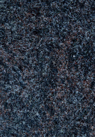Close-up of polished dark granite with black, gray, and reddish speckles.