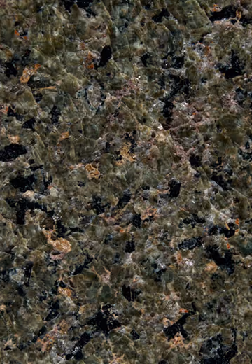 Close-up texture of polished granite with green, black, and brown mineral patterns.