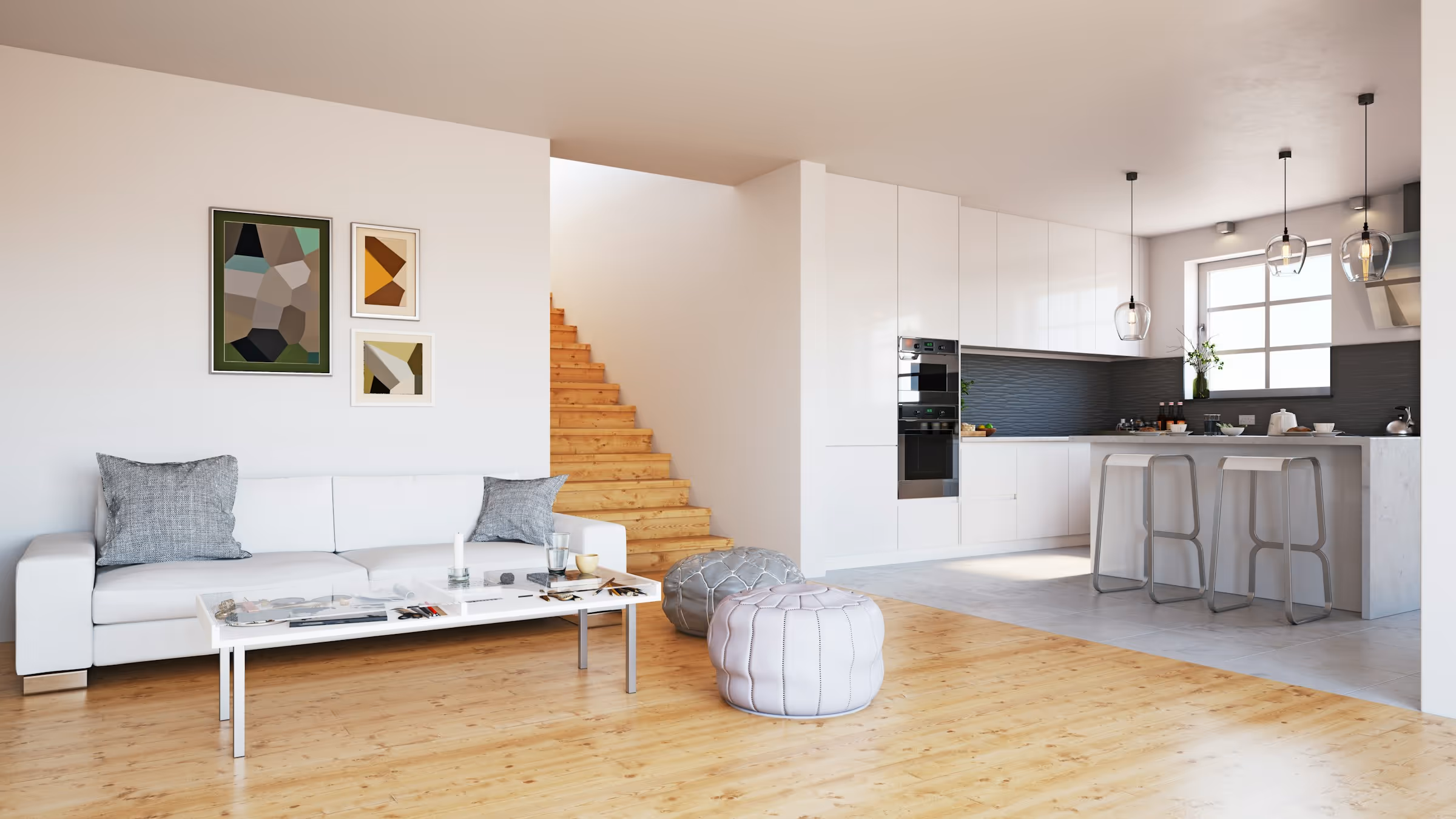 Modern open living room and kitchen with white sofa, two gray poufs, wooden stairs, and minimalist decor.