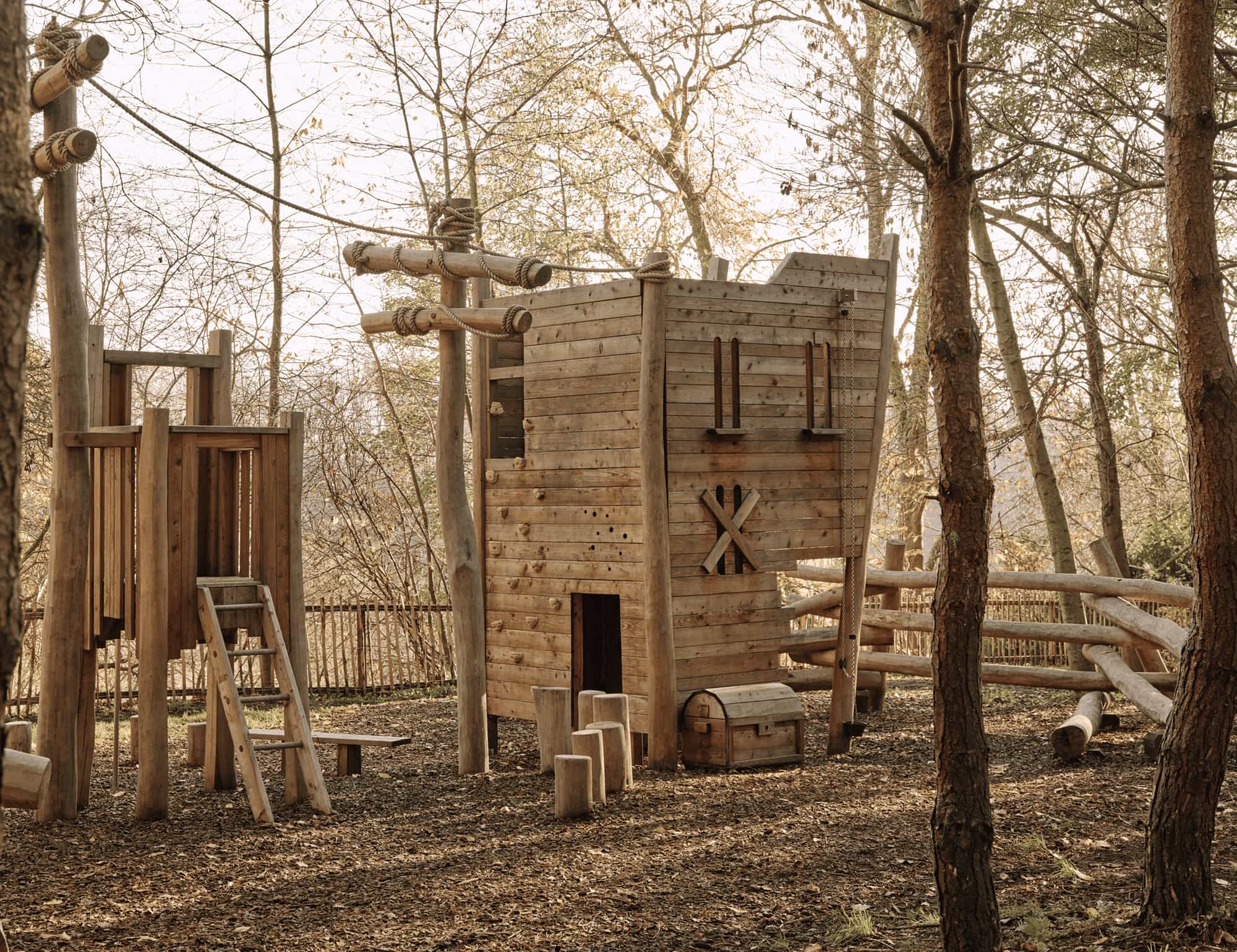 Wooden children's adventure playground in the woodland at Milne Graden