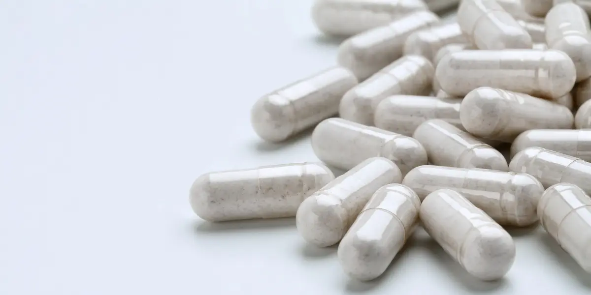 white capsules on a surface