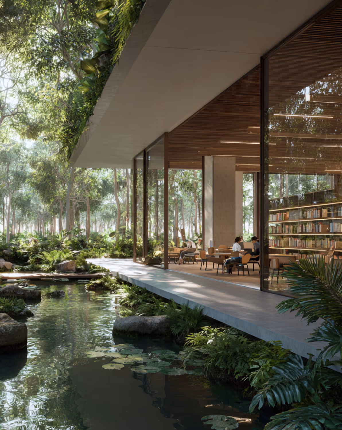 Modern building with floor-to-ceiling glass windows overlooking a lush forest and a pond with lily pads and rocks.
