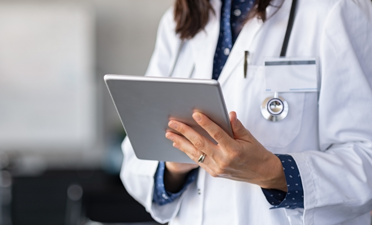 Doctor touching a tablet