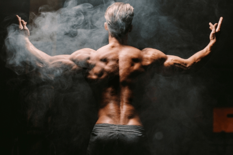 Fit adult man showing back muscles, representing strength, muscle mass, and men’s hormone health.