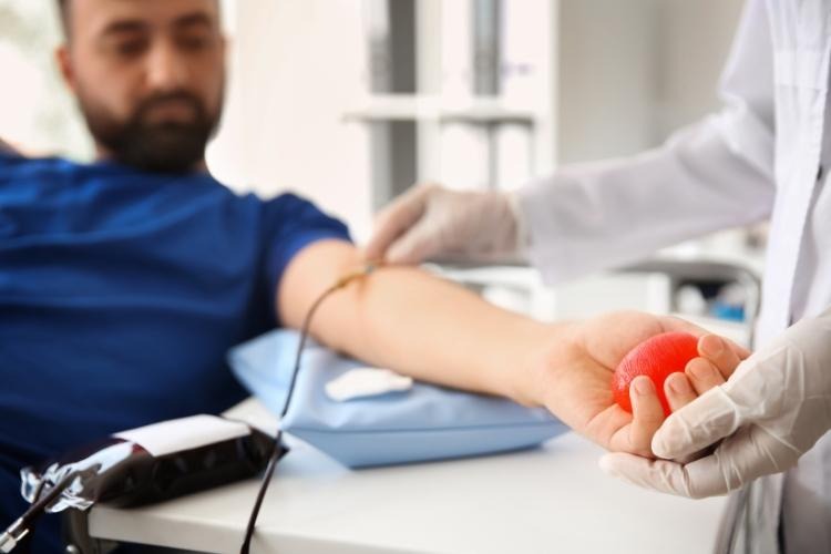 Blood donation to help manage elevated hematocrit levels.