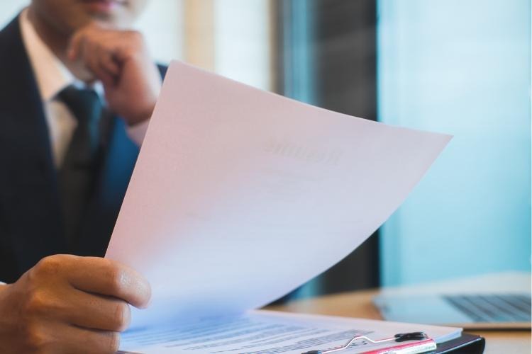 Man holding a document.