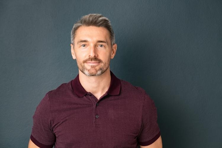 Man in maroon t shirt.