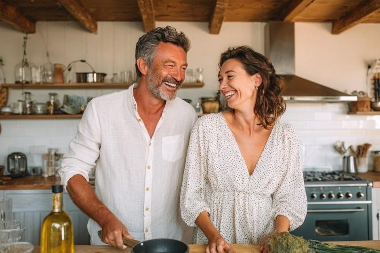 Happy couple cooking in the kitchen