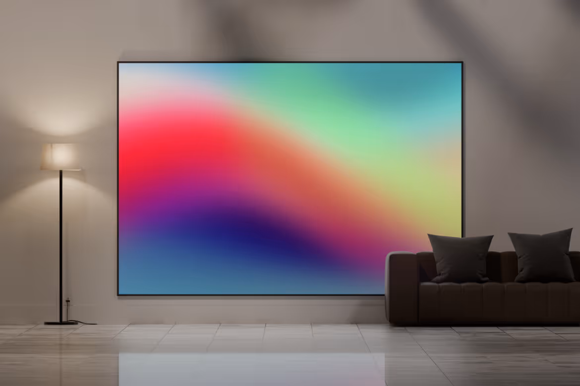 A living room with a couch and a painting on the wall.