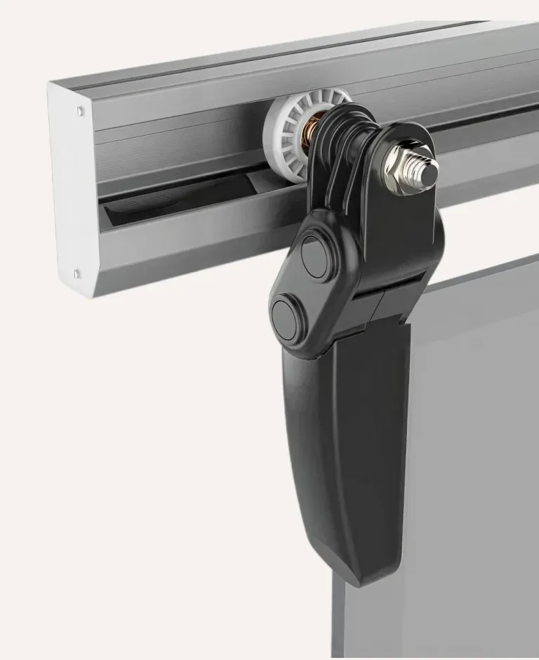 Close-up of a black adjustable clamp attached to a silver metal rail with a white gear wheel.