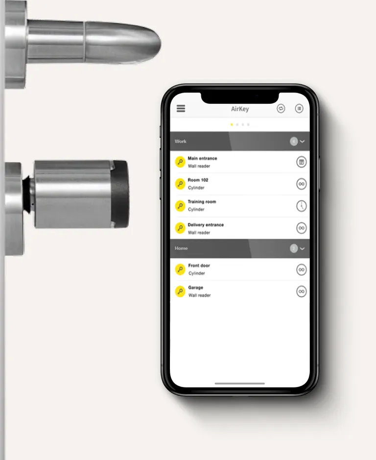 Smartphone displaying AirKey app for managing digital access to doors, shown next to a modern metallic door lock.