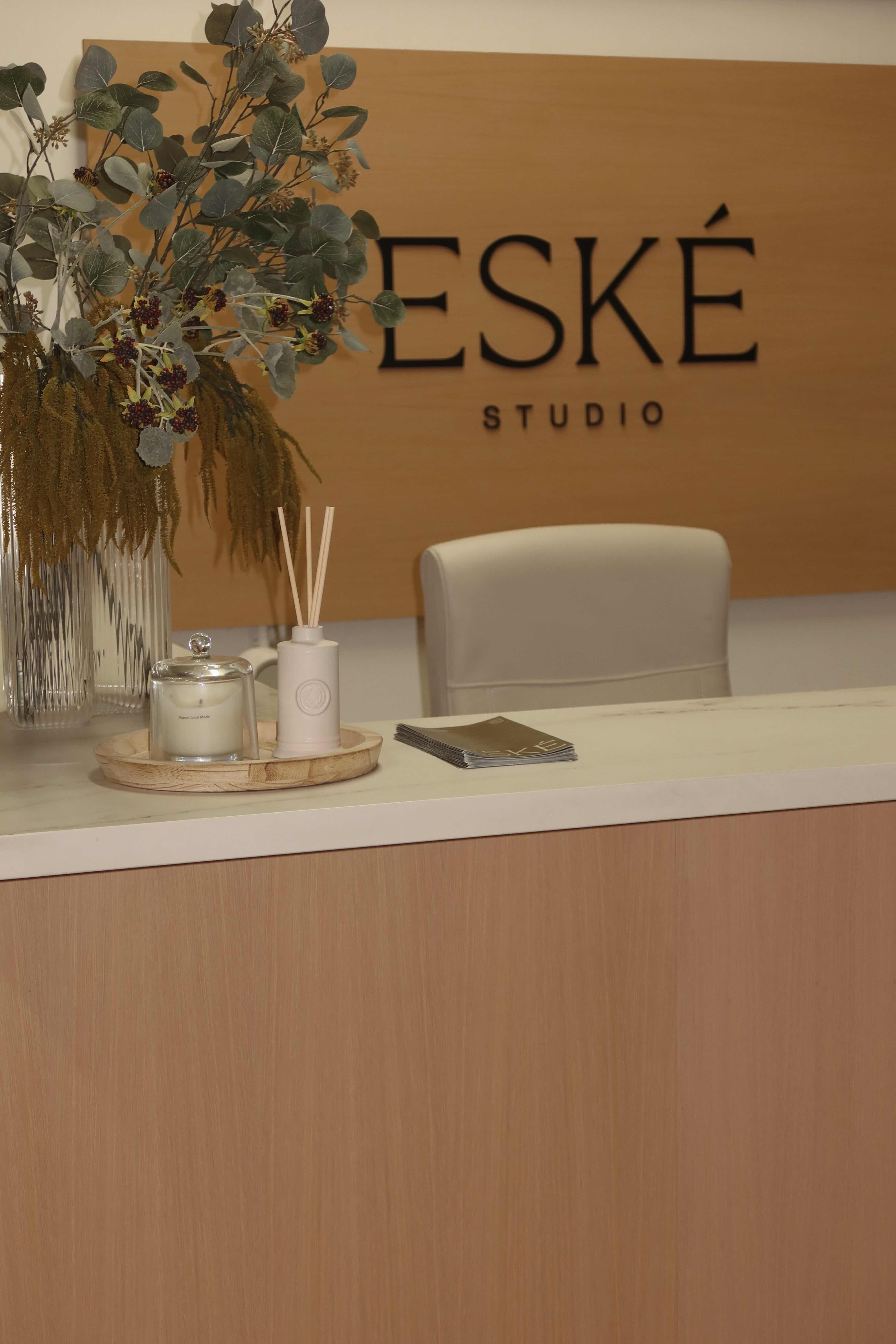 Eské Studio reception desk with stone countertop and wood cabinetry, San Jose showroom