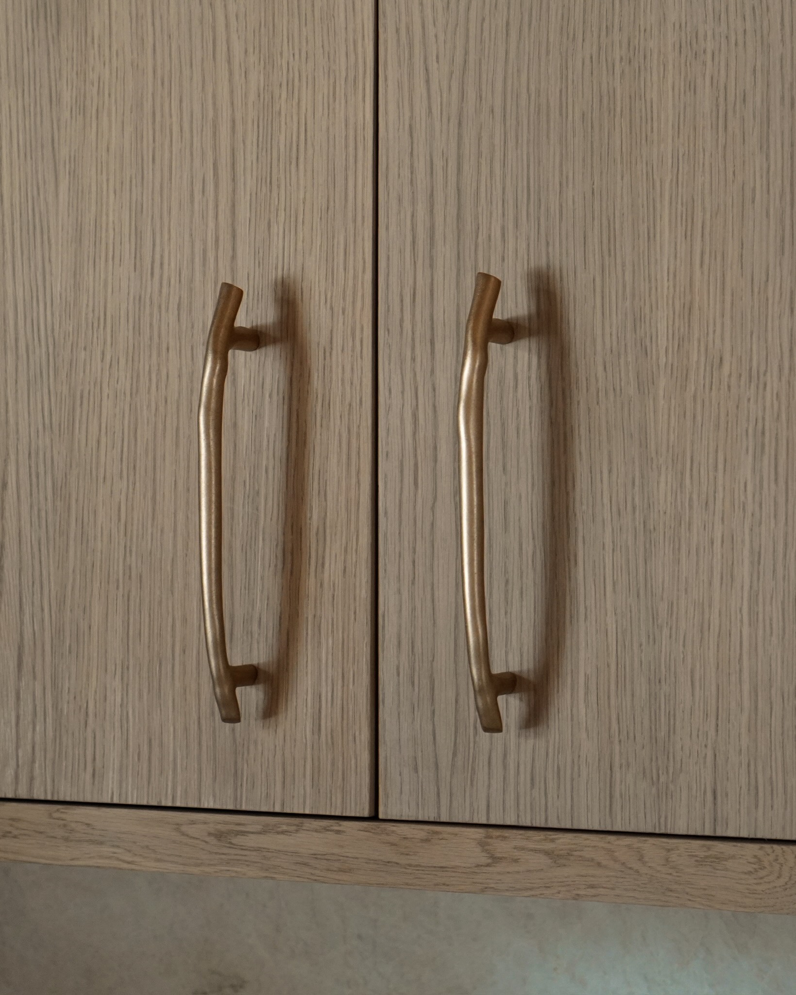Brass cabinet pull detail on white oak cabinetry, Lake Tahoe chalet