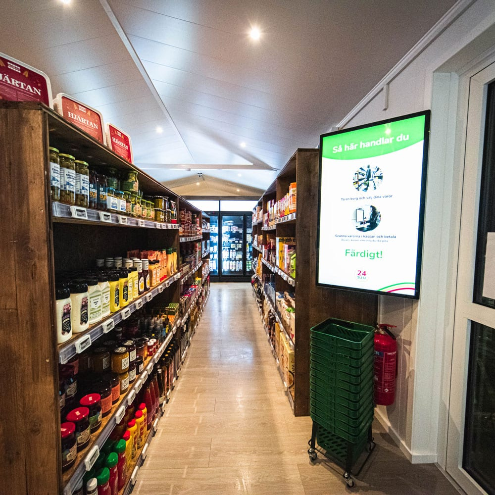 [background image] image of storefront (for a grocery store)