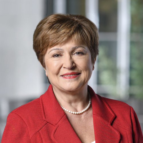Portrait photograph of a woman with long hair, smiling.