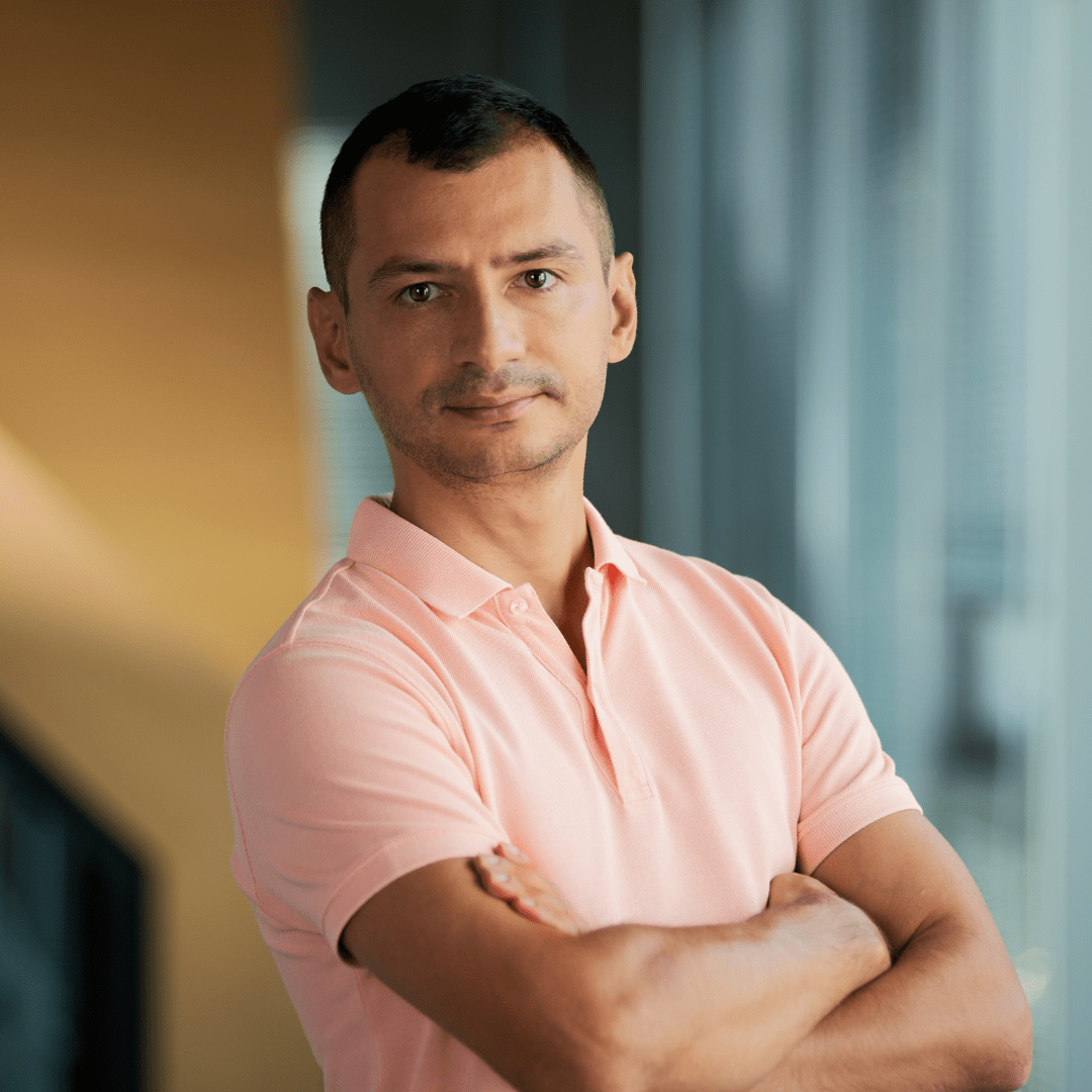 Portrait photograph of a woman with long hair, smiling.