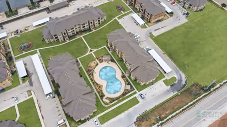 Birds eye view of exterior and pool