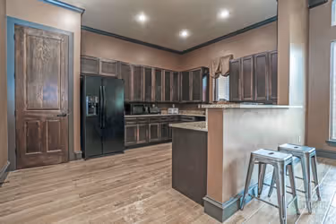 clubhouse kitchen with black appliances
