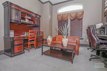Business room with computers, desks, and chairs