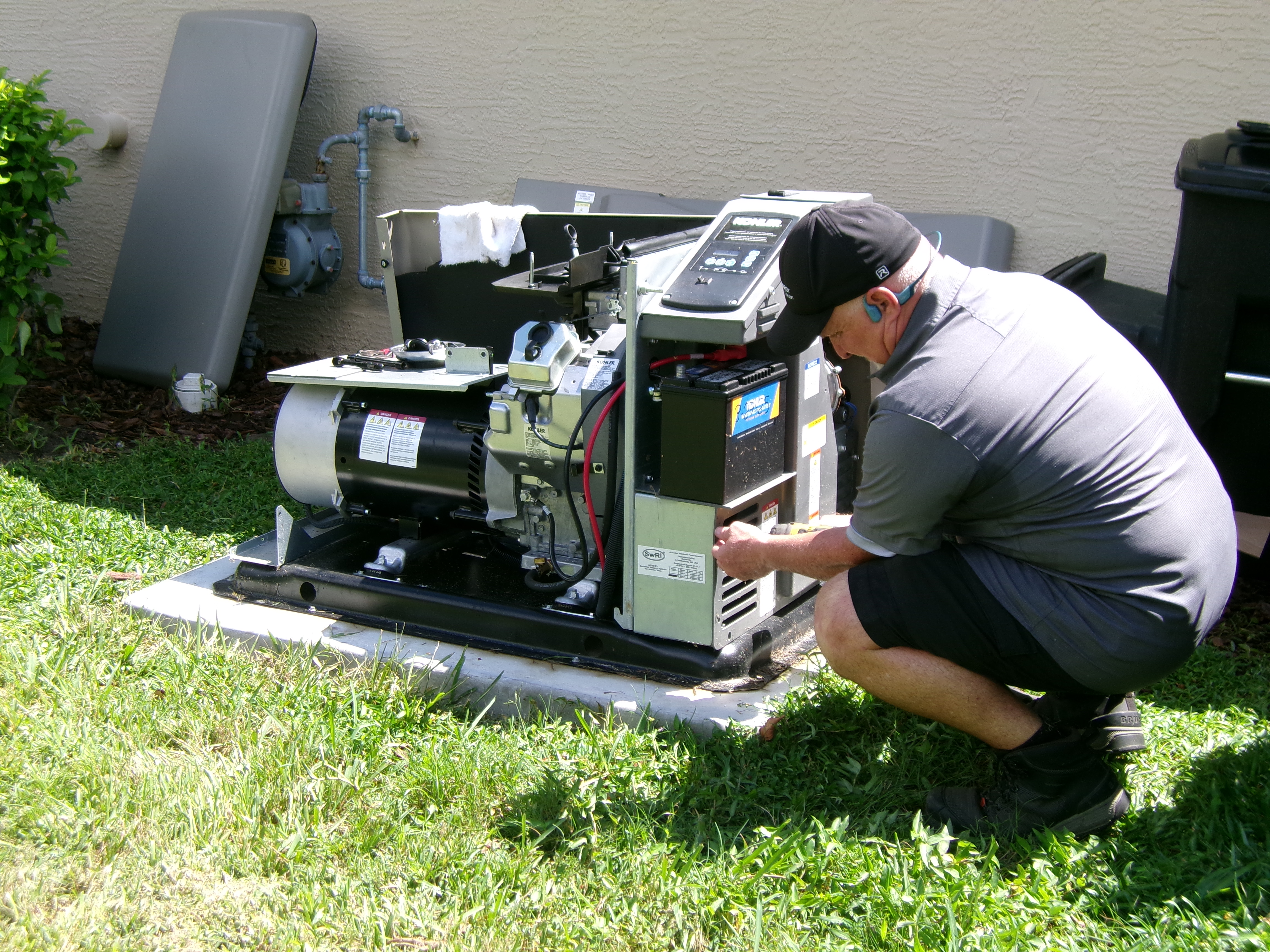 Air & Energy technician repairing Kohler generator