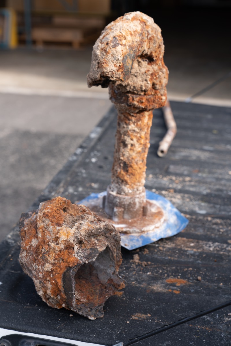 Two heavily rusted sections of old steel water pipe removed from a house during a repipe