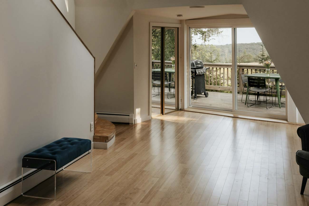 room with hardwood floors and sliding door